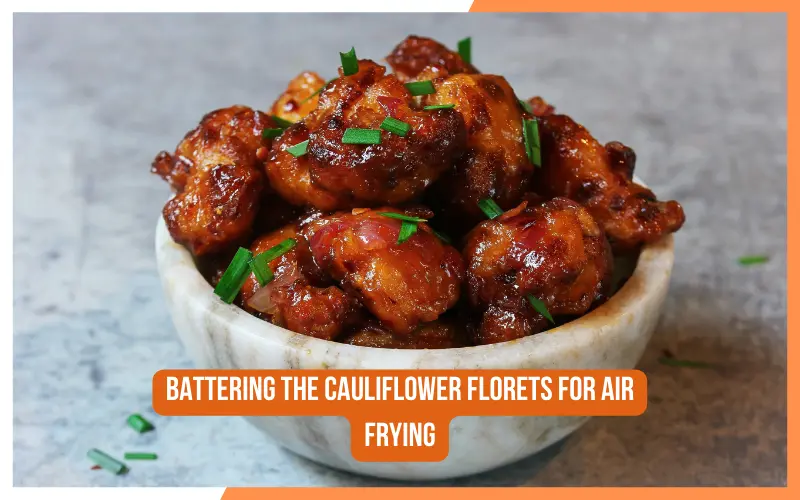Battering the cauliflower florets for air frying