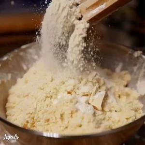Mix flour and parmesan cheese together